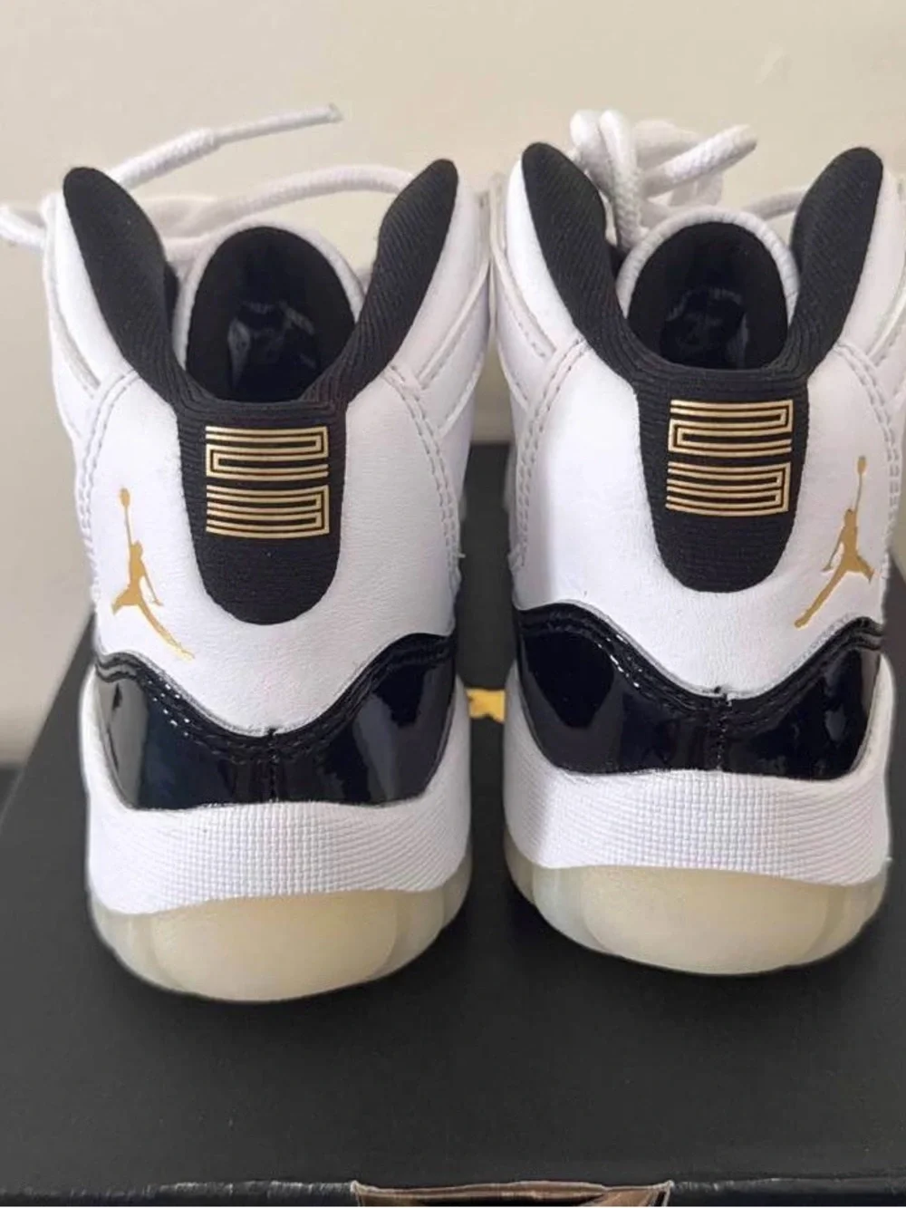 Jordan Kids Retro 11 Sneakers in White, Black & Gold